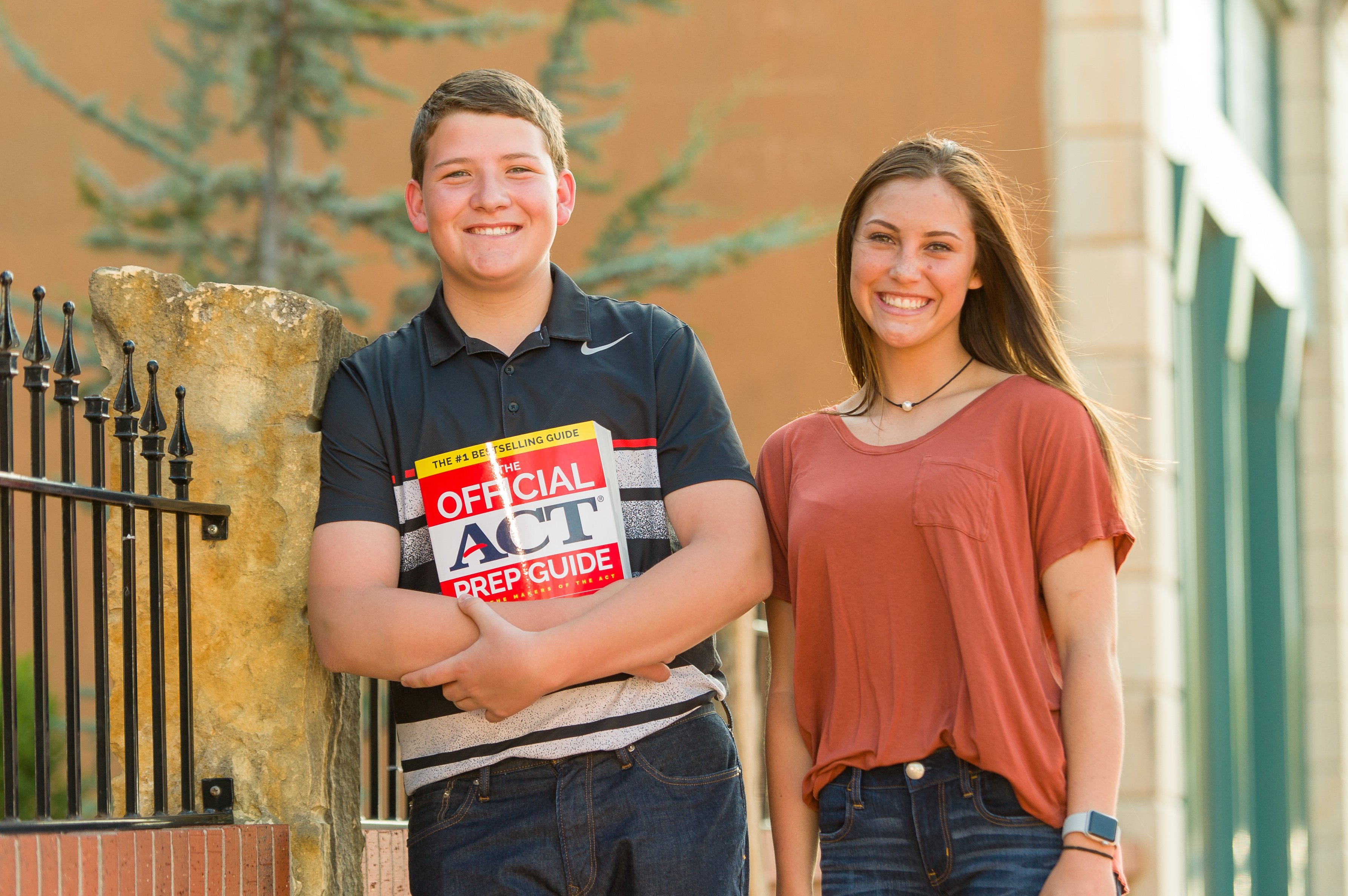 Guy and girl with ACT Book